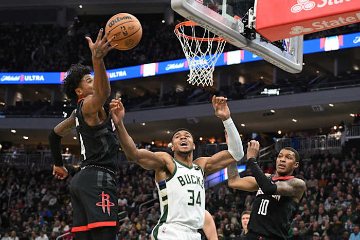 Milwaukee Bucks forward Giannis Antetokounmpo (34) battles for a rebound with Houston Rockets guard Jalen Green (4)